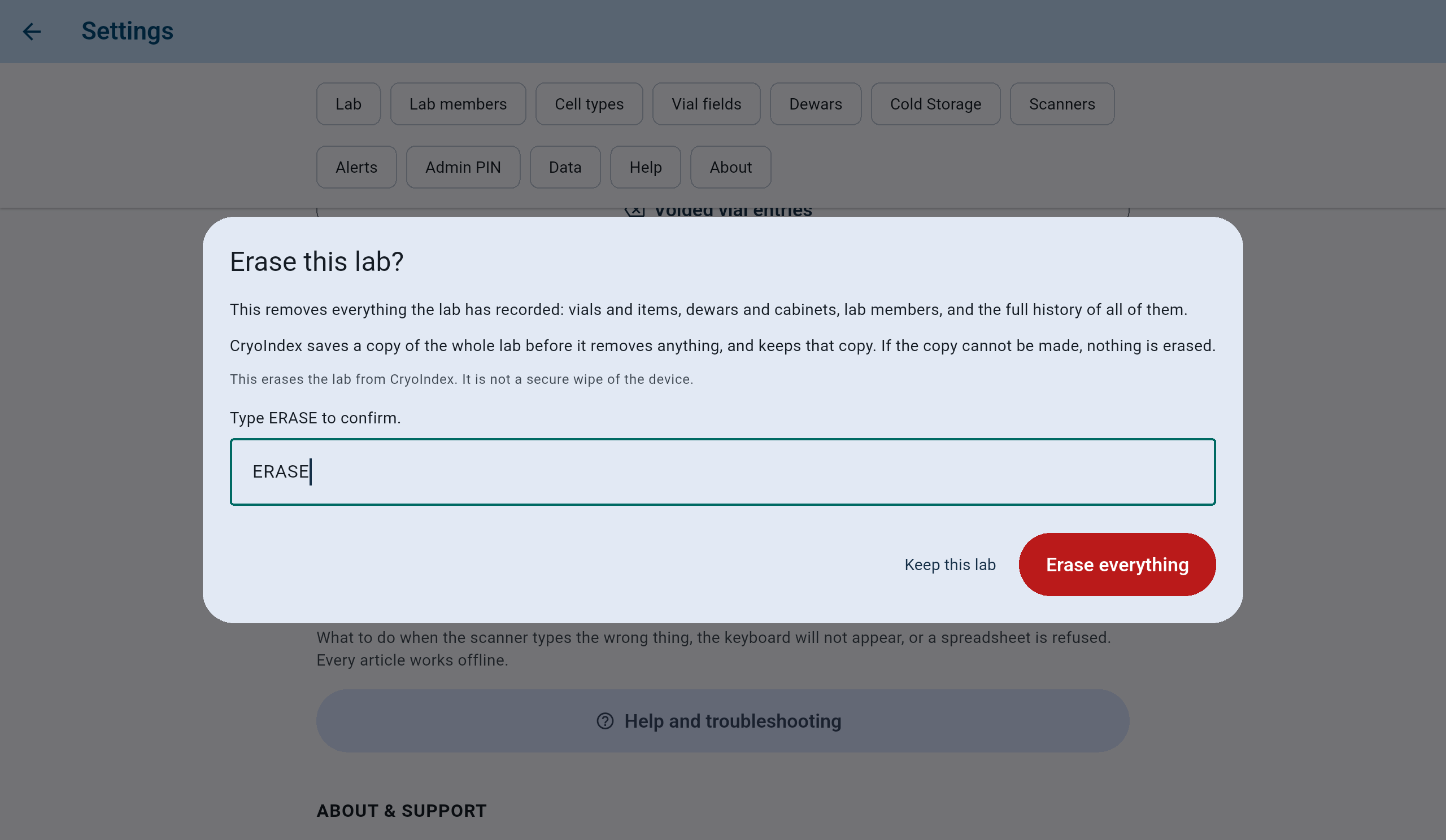 The Erase this lab? dialog over Settings: what erasing removes, that a copy of the whole lab is saved first and kept, that this is not a secure wipe of the device, Type ERASE to confirm with ERASE typed, and the buttons Keep this lab and Erase everything.